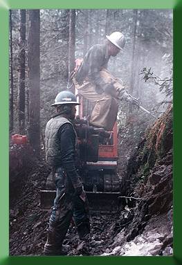 Russ Dalton and Robert Mitton:  Kubota with drilling attachment.