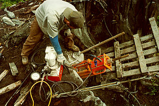 Keith Monohan testing 14' long rock anchors with 60-ton hydraulic through-jack.
