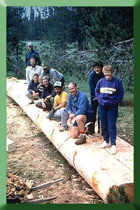 Timbers for Bend, OR, bridge after hewing deck and cutting of railing dovetail mortises.