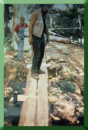 Alicia Spence and Carroll Vogel at Dillon Ranger District, CO, 1988.  Solid stringer Wilderness bridge with dovetail deck splines.