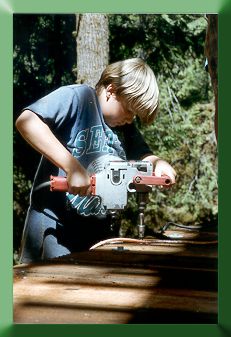 The next generation bridge builder:  Nephew Bryce Thompson installing decking