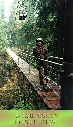 Bridge near completion, prior to fence installation; note personnel basket hanging in background