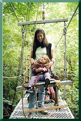 Daughter Skye on the bosun's chair with her mom, and my partner, Jennifer Knauer behind.
