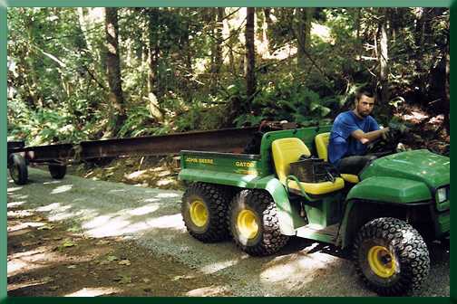 Marco Ernandes trailering tower legs over trail to the west abutment.