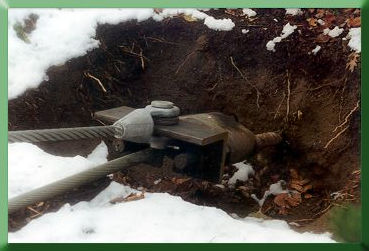 Angle fitting for attaching temporary mainline to existing anchor rods.  Designed to facilitate later placement of original mainlines on new permanent towers.