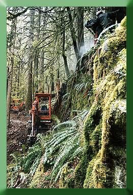 Russ Dalton and Roger Babcock drilling rock above Kubota.