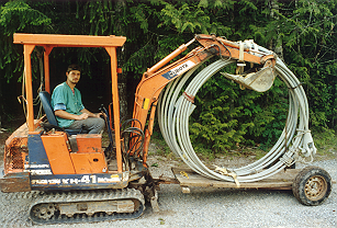 Cable stays, ready for delivery over trail to bridge site.