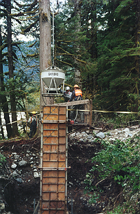 Pouring concrete delivered by helicopter.
