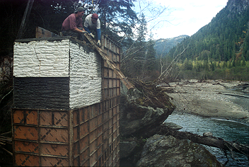 Keith and Kevin Monohan stripping forms; note concrete texture.