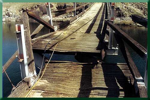 Ground zero, near mid-span.