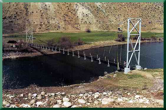 Working from the basket, installing new suspenders.