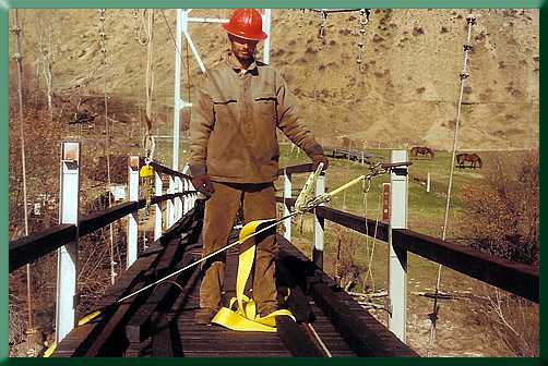 Fine tuning method A:  Tweaking posts to plumb with a ratchet strap.