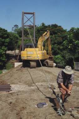 Brandon McGinnis pulls the first mainline into position.