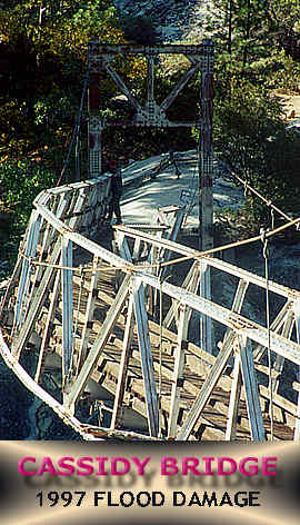 View of flood damage:  Note broken upriver suspenders, deflected mainlines and of course, the bent truss.