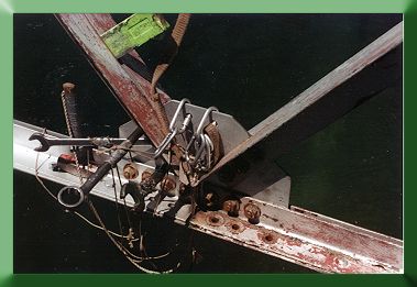 Aligning the last piece with spud wrenches.