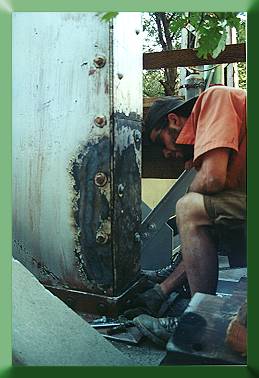 Keith Monohan completing straightening of damaged tower base.