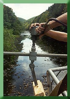 Installing suspenders above Greenbrier River
