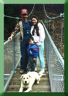 Bridge builder Greg Riffe and family on Greenbrier Bridge with Filson