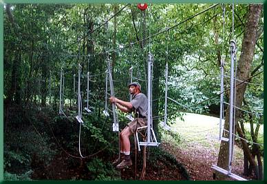 Keith Monohan installing suspenders from bosun's chair on skyline.