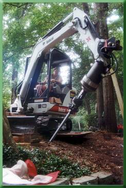 Installing battered pile for main cable anchor.