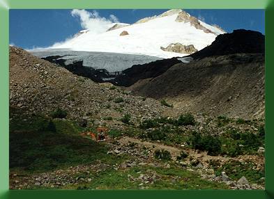 Excavating trail above base camp with Kubota.