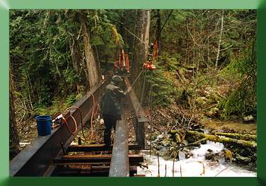 Installing stringers, 100' span Blum Creek Bridge, WA.