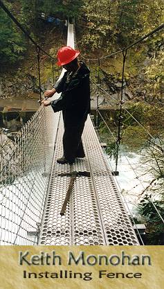 Attaching fence to the upriver side of bridge; note fishway below, on far side of the river